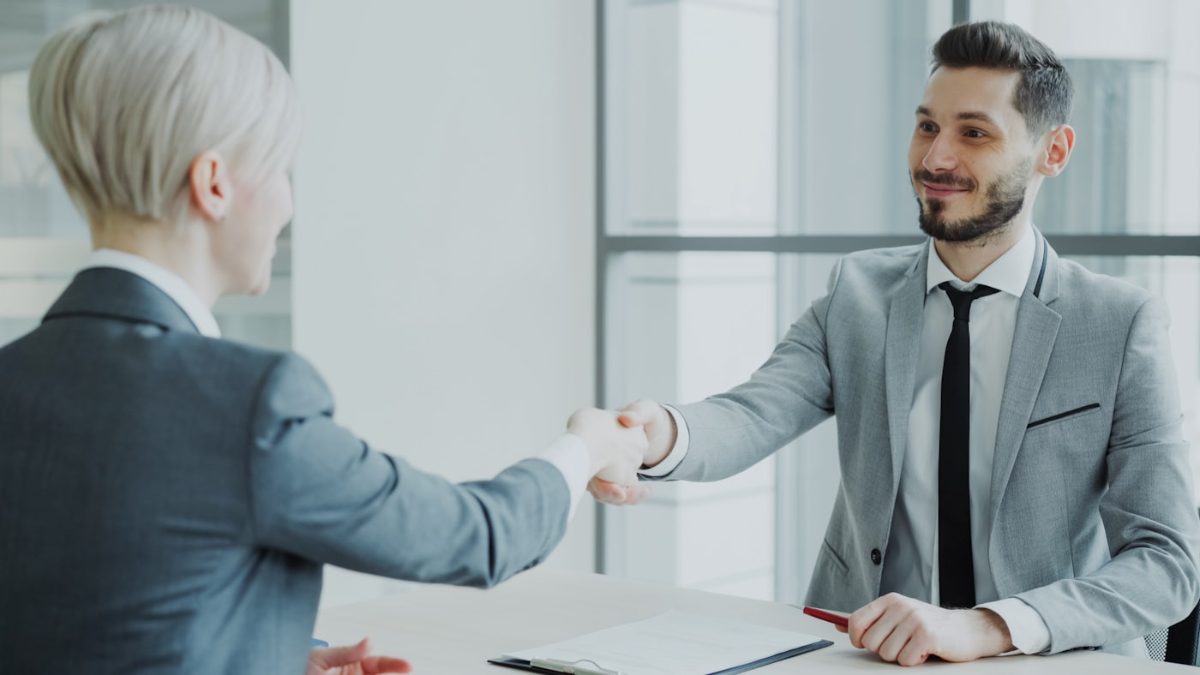 Business professionals shaking hands in a meeting